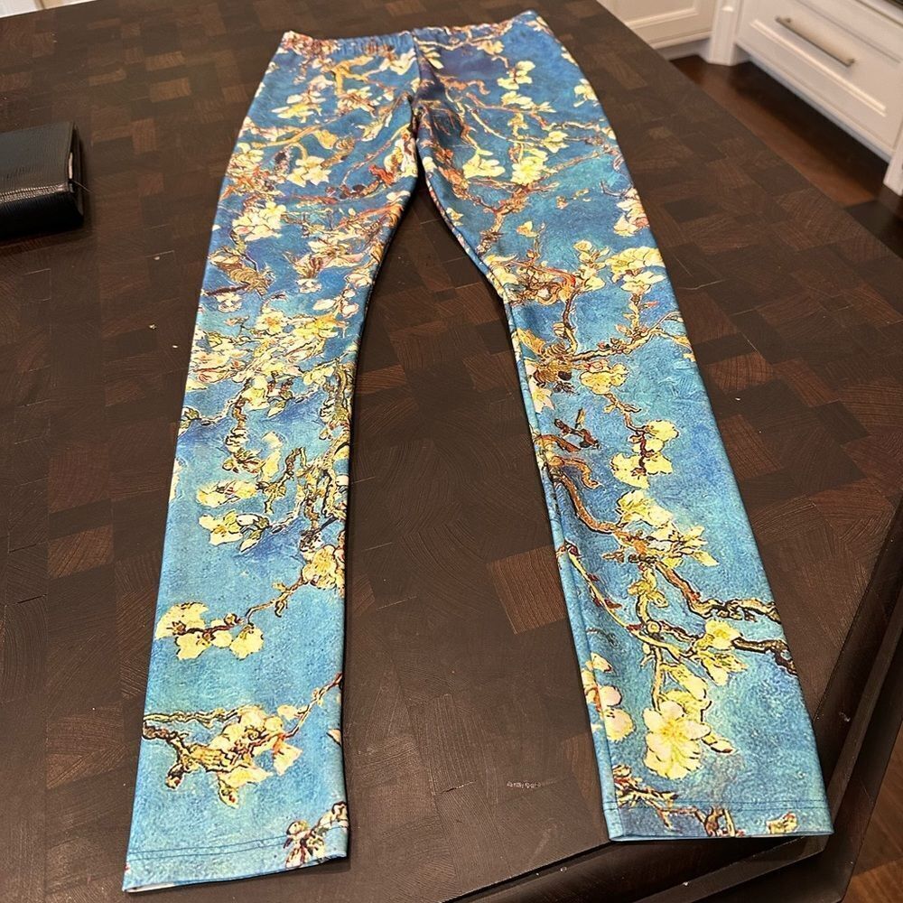 Poprageous blue and gold pattern workout leggings. Size medium